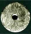 円形で中央に穴が開いている紡錘車の画像